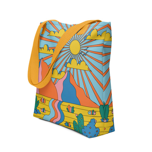 Colorful tote bag with a sun and landscape design on a white background